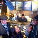 Protestor Asa Khalif (R) addresses Starbucks Mid-Atlantic Regional Vice President Camille Hymes (C) on Monday in the Philadelphia Starbucks where police arrested two black men, prompting an apology from the company’s CEO.
